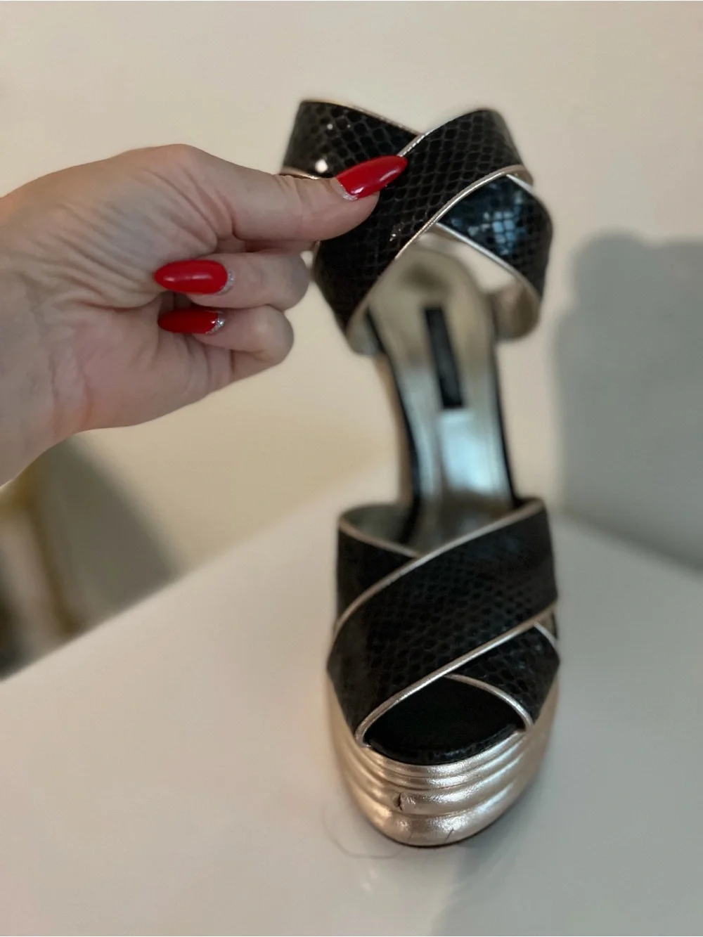 Dolce & Gabbana Black Snakeskin Wedge Sandals with Gold Accents..